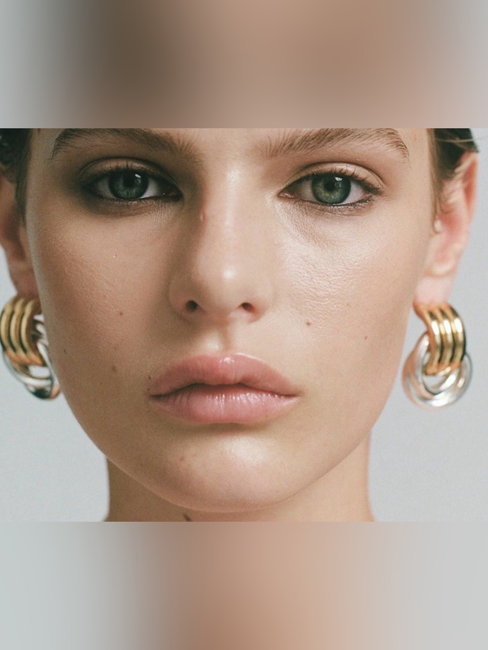 Heaven Mayhem Two-Tone Double Knot earrings made from gold and silver-plated